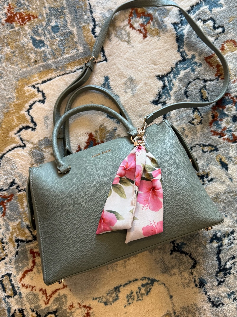 Anne Klein sage green leather satchel with pink floral scarf charm